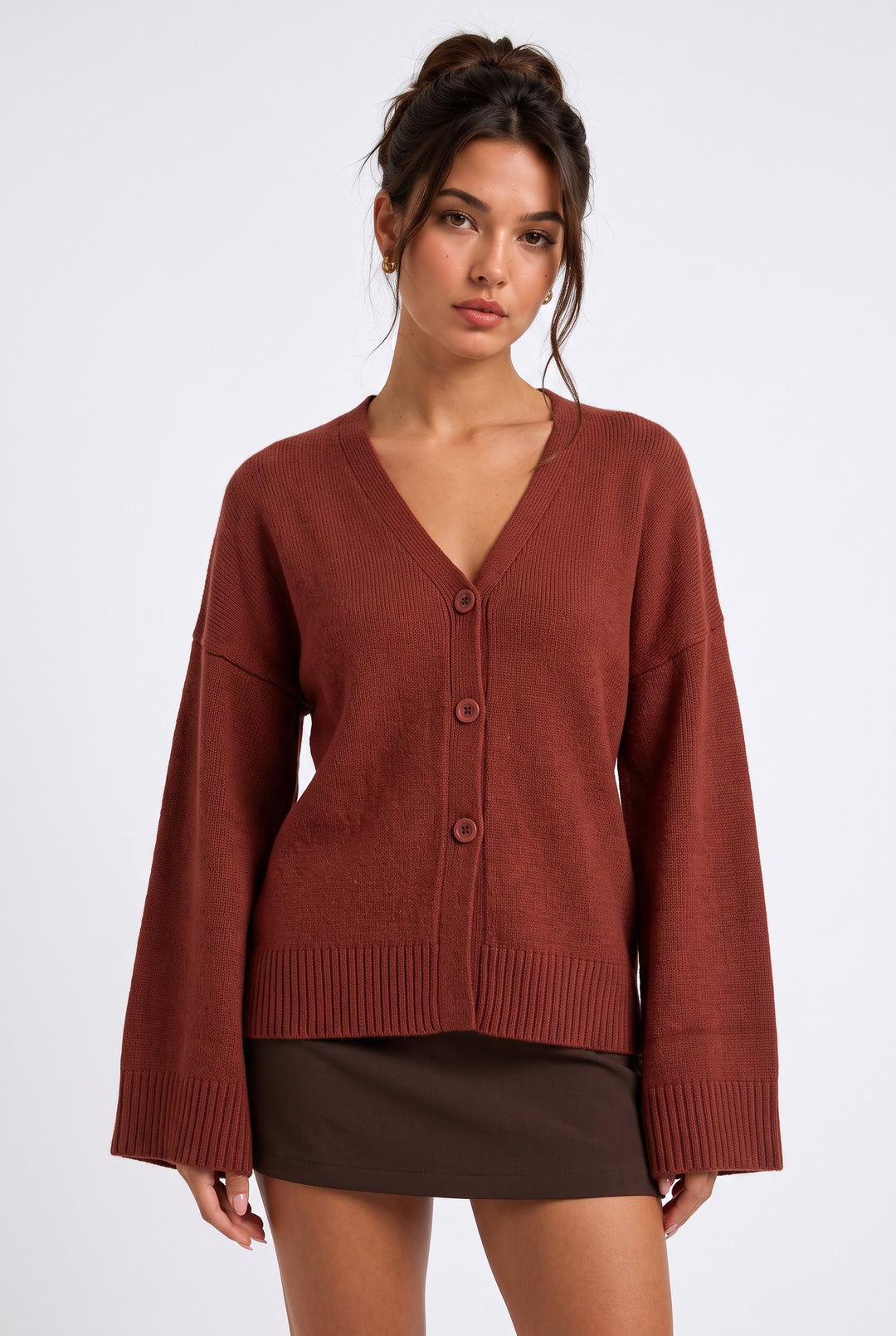 lily Averlyn brick red V-neck knit cardigan with wide sleeves and button-down front worn by a model