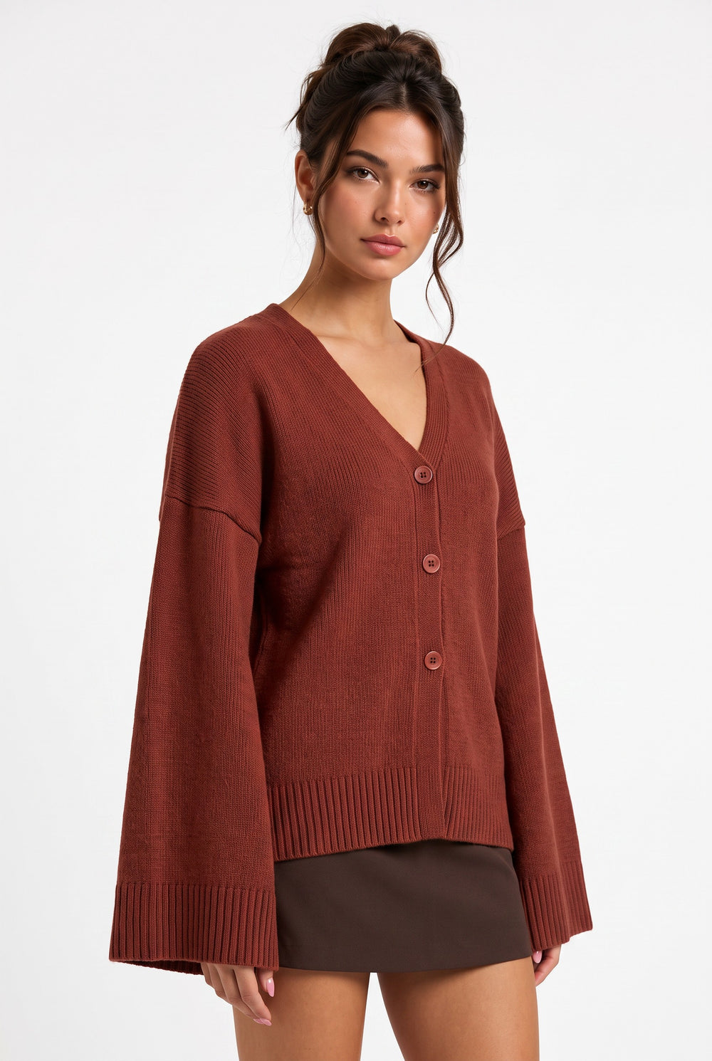 lily Averlyn brick red knit cardigan with V-neck, button front, and wide sleeves worn by a model