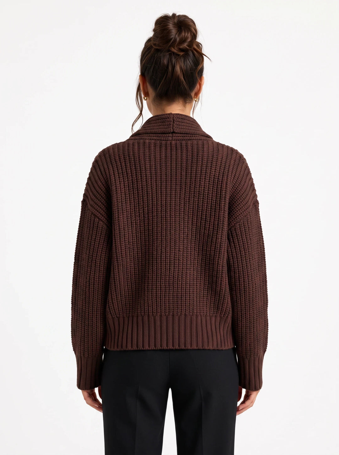 Back view of a lily brown chunky ribbed wool-blend cardigan with a structured collar worn over black trousers