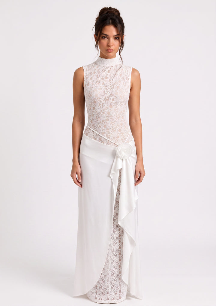 lily Celeste Lace Rosette Gown featuring white floral lace, a mock neckline, and a draped chiffon skirt with a rosette.