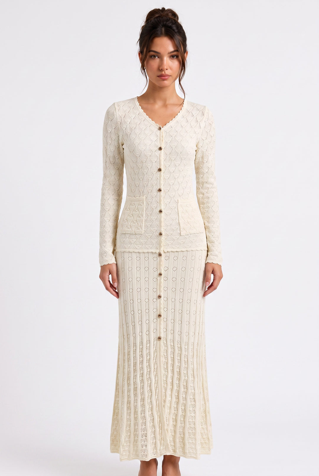 lily Mirella cream crochet knit maxi dress with V-neck, gold buttons, and long sleeves on a model