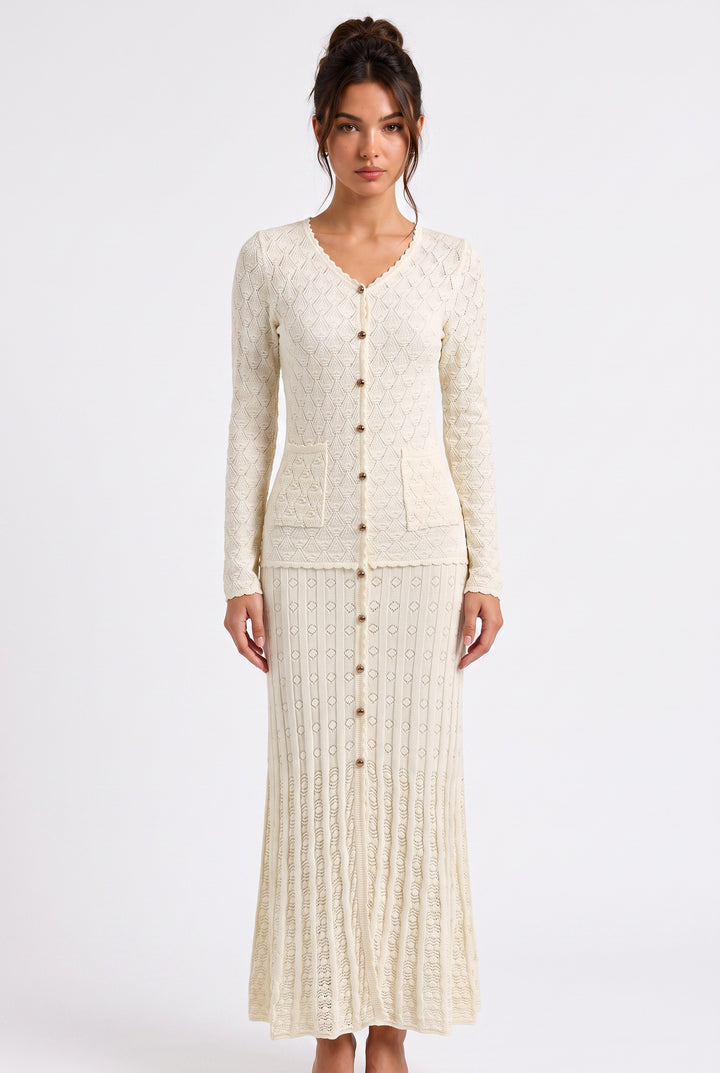 lily Mirella cream crochet knit maxi dress with V-neck, gold buttons, and long sleeves on a model