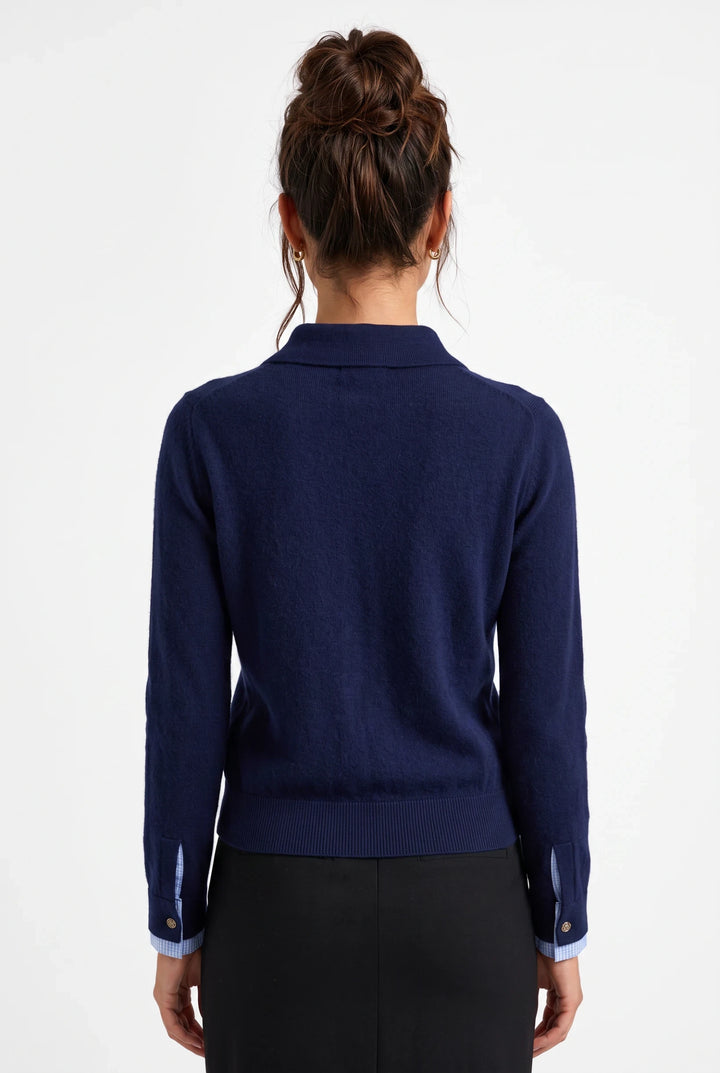 Back view of lily Sophie navy wool-blend polo knit top with long sleeves, ribbed cuffs, and contrast inner cuff detail.